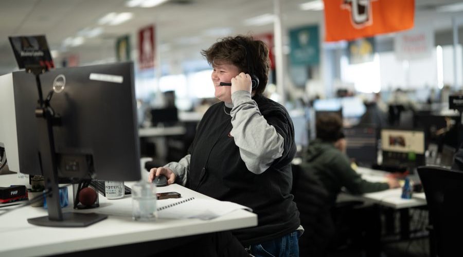 FWF intern on a call at her standing desk