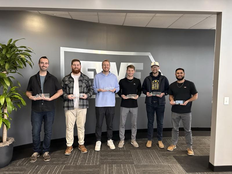 FWF team holding awards