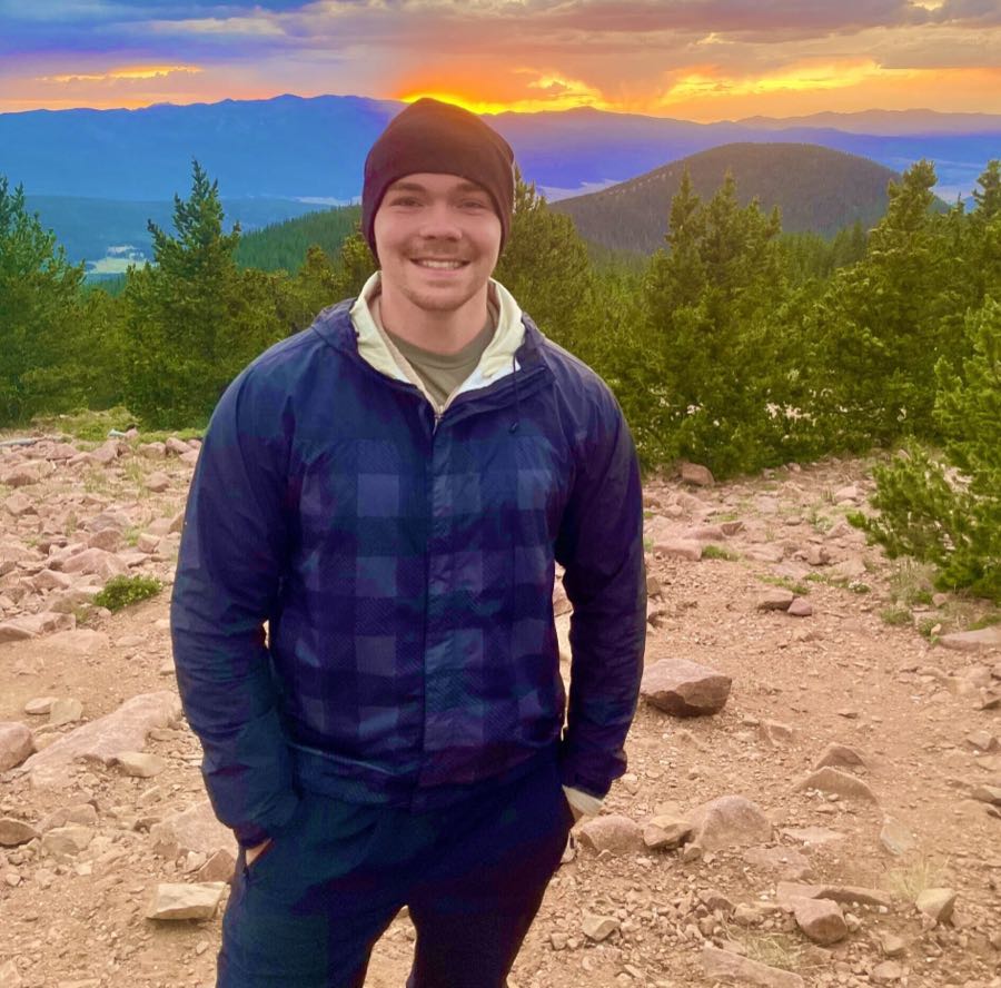 Ryan hiking at sunset in the mountains